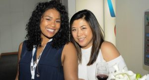 Attendees enjoying happy hour in the American Airlines Passholder Lounge